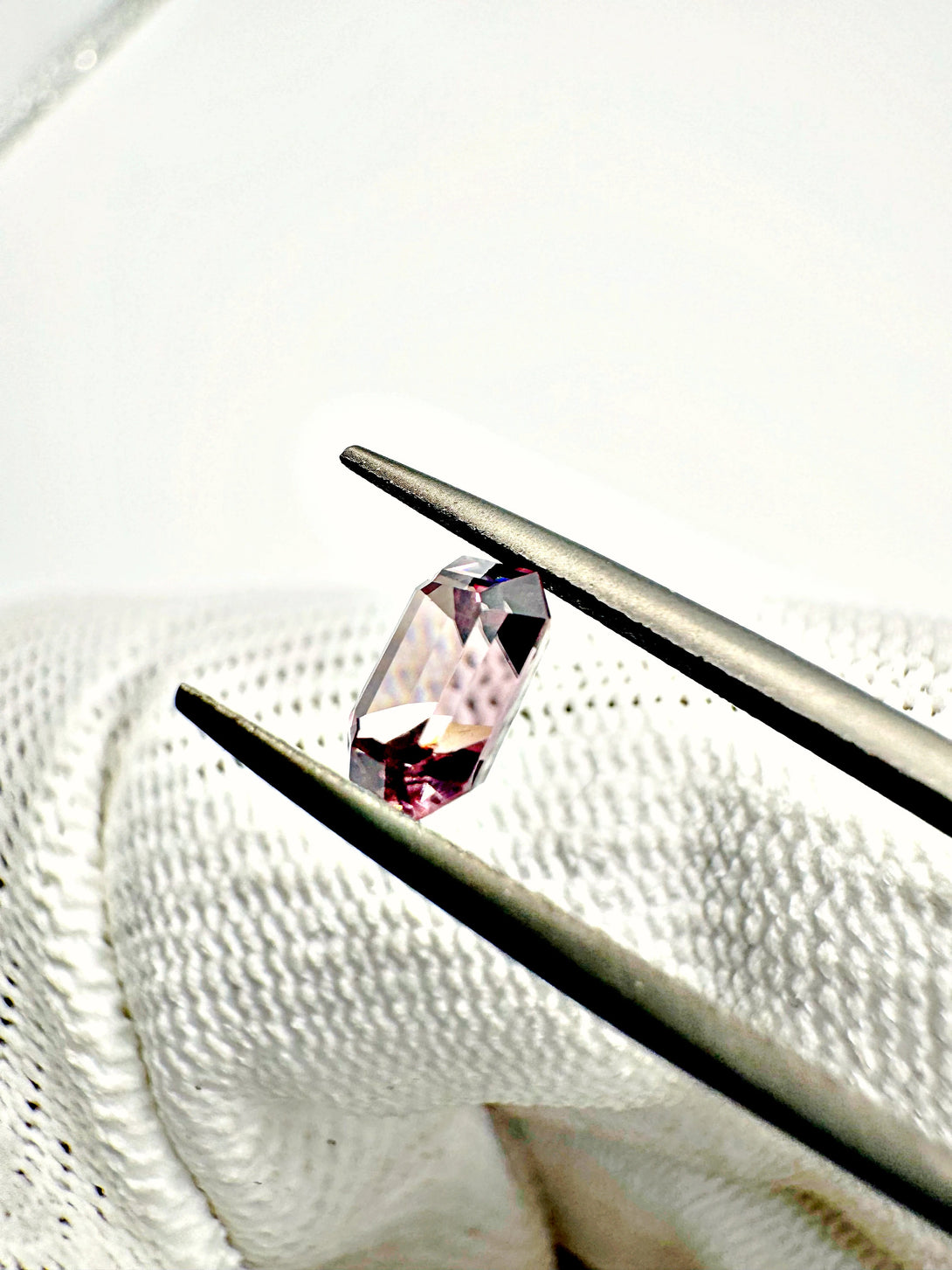 The Dusty Pink Cosmic Relic | 1.54ct Emerald cut Zircon from Singida - LUVICI GEMS INTERNATIONAL