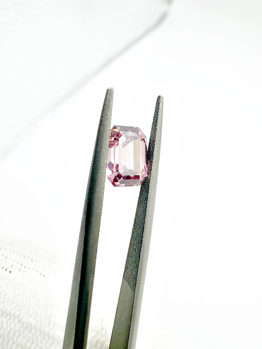 The Dusty Pink Cosmic Relic | 1.54ct Emerald cut Zircon from Singida - LUVICI GEMS INTERNATIONAL